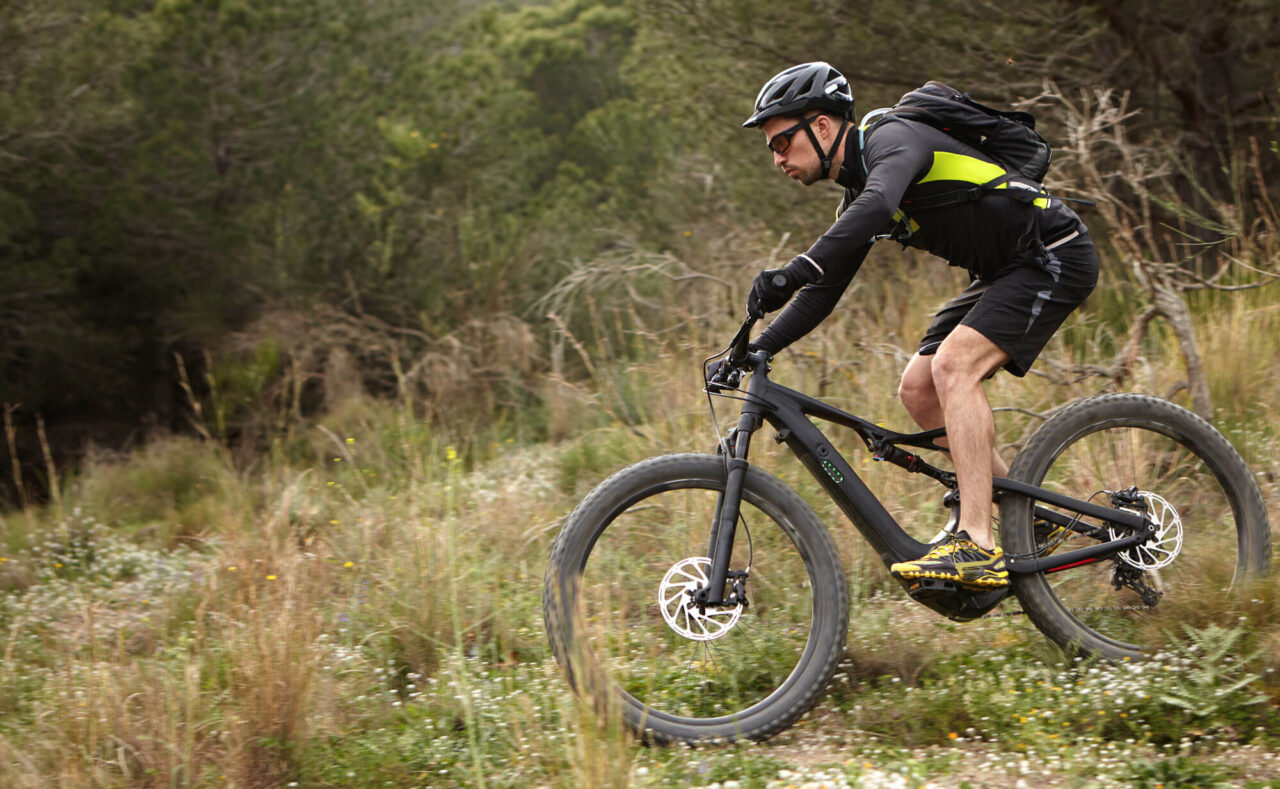 young-rider-cycling-on-pedelec-in-forest-making-m-2023-11-27-05-35-33-utc-1.jpg